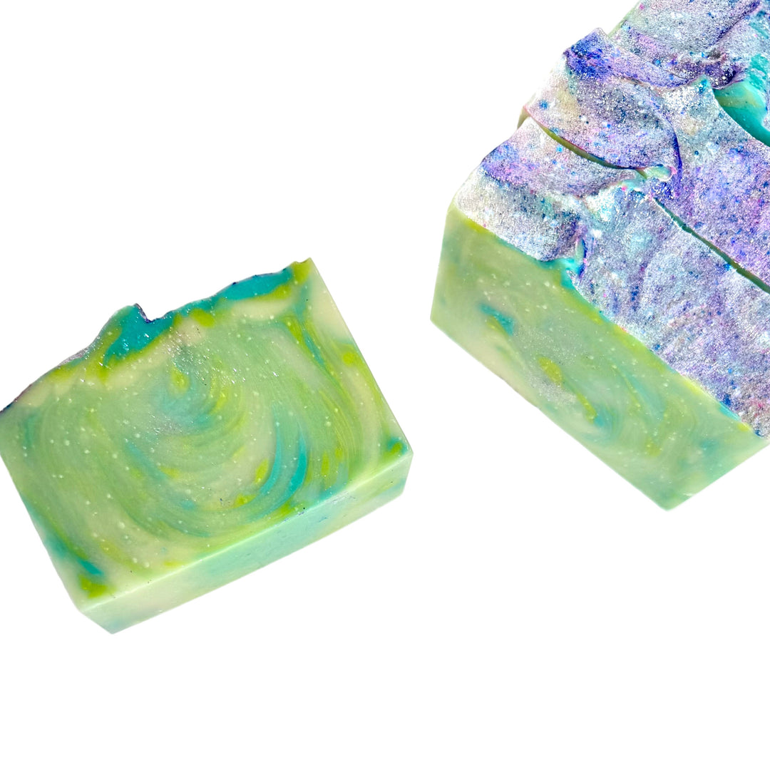 Handcrafted artisan soap bar with bold green, blue, and purple swirls, scented with a juicy berry medley of blueberry, raspberry, grape, strawberry, and peach, Blueberry No. 9 by Dirty Little Suds.