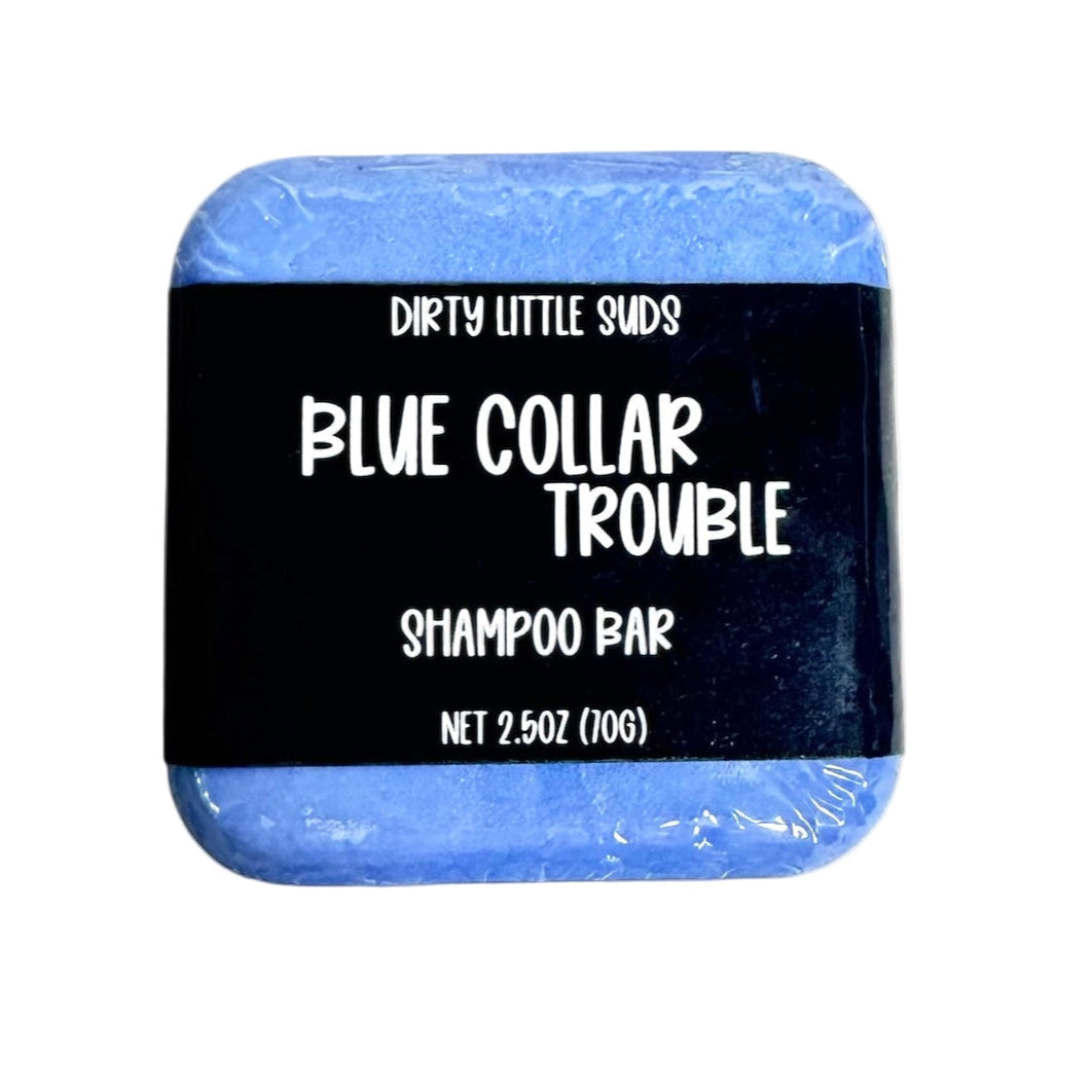 Dirty Little Suds Blue Collar Trouble shampoo bar with black label, shown front-facing on a clean white background, 2.5 oz size.