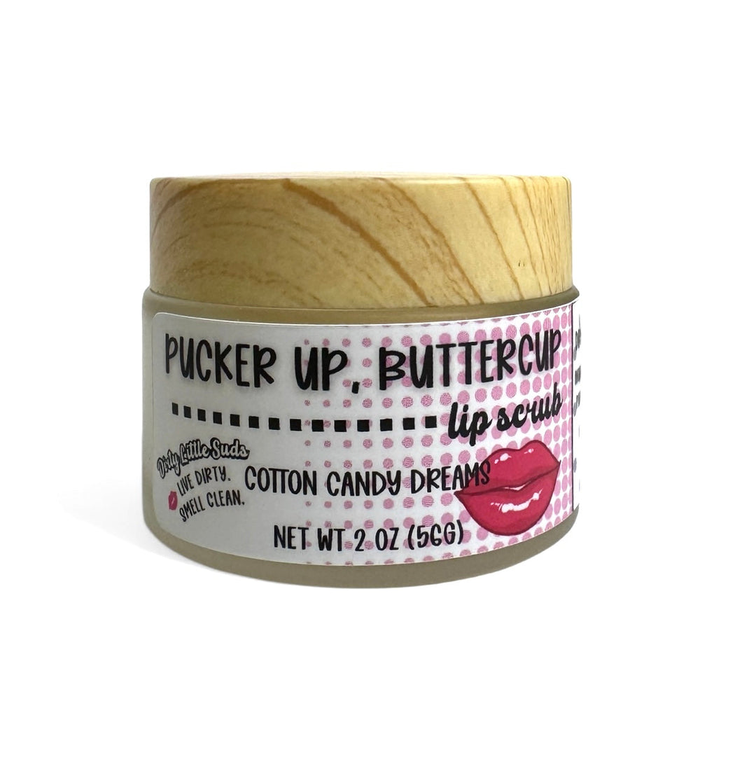 Dirty Little Suds “Pucker Up, Buttercup” Cotton Candy Dreams sugar lip scrub (2 oz). Gentle lip exfoliator that smooths flakes and hydrates for soft, glossy lips; coconut oil, shea butter, almond oil, vitamin E.