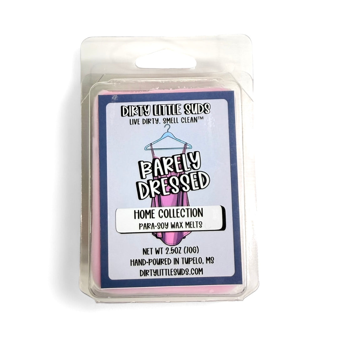 Clamshell pack of Dirty Little Suds Barely Dressed wax melt with a retro-inspired label. A smooth and sultry fragrance blending soft milk and ambrette with tuberose, smoky incense, vanilla, cocoa, and musk for an intimate yet bold scent.