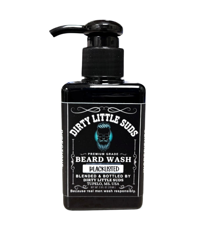 Black rectangular pump bottle of Dirty Little Suds Blacklisted Beard Wash with bold white vintage lettering on a black label. Men’s sulfate-free beard cleanser that leaves beards clean, soft, and smooth.