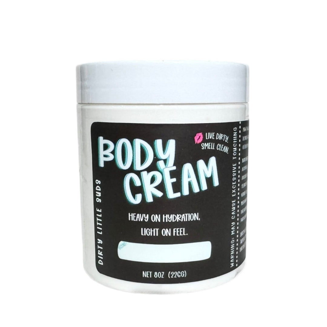 Dirty Little Suds Body Cream 8oz jar on a plain white background. Rich, lightweight body moisturizer that delivers heavy hydration with a light feel.