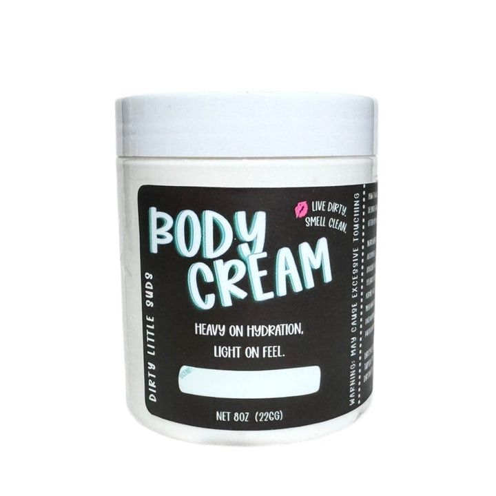 Dirty Little Suds Body Cream 8oz jar on a plain white background. Rich, lightweight body moisturizer that delivers heavy hydration with a light feel.