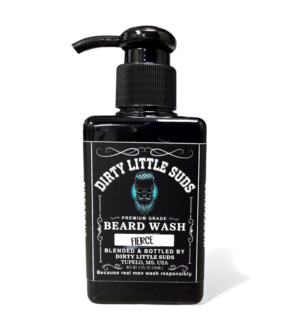 Black bottle of Dirty Little Suds Fierce Beard Wash featuring a vintage-style label and skull-beard logo. Men’s beard wash that cleans deeply and leaves a bold, fresh scent.