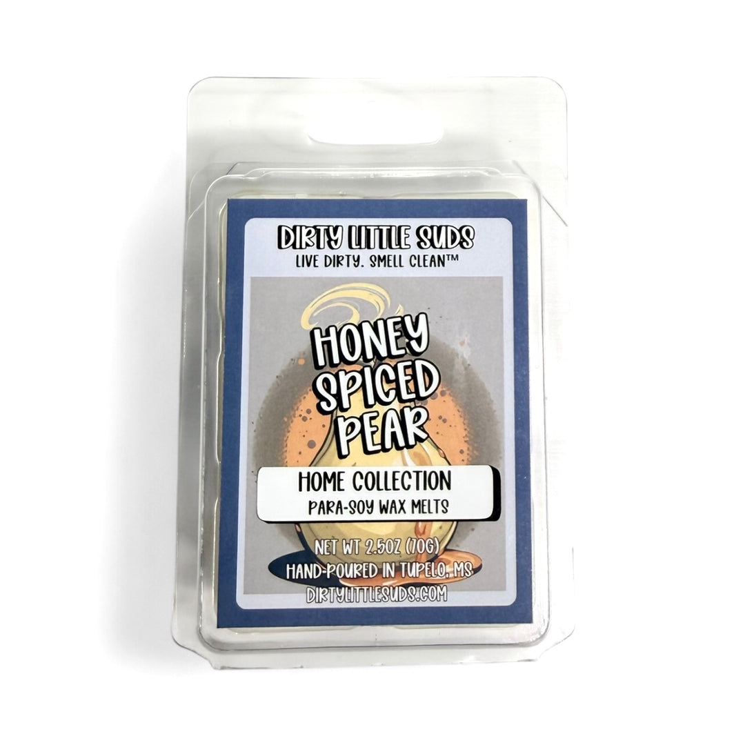 Clamshell pack of Dirty Little Suds Honey Spiced Pear wax melt with a retro-inspired label. A sweet and spiced fragrance of ripe pears with sugar crystals, nutmeg, cinnamon, and a hint of earl grey tea for a cozy yet elegant scent.