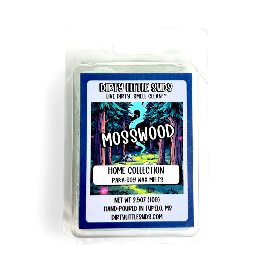 Clamshell pack of Dirty Little Suds Mosswood wax melt with a retro-inspired label. An earthy, grounding fragrance that blends green moss, soft woods, and subtle musk for a fresh yet calming scent.