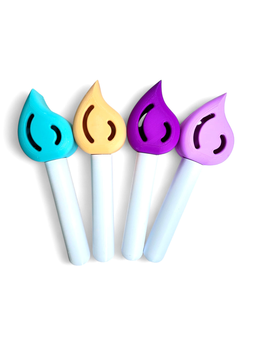 Set of four Dirty Little Suds paint brush style bath bomb wands in Aqua Spark (turquoise), Sunburst (orange), Midnight Magic (dark purple), and Pixie Lavender (light purple). Designed to be used with jelly bean bath bomb refills for colorful, fizzing, imaginative bath play.