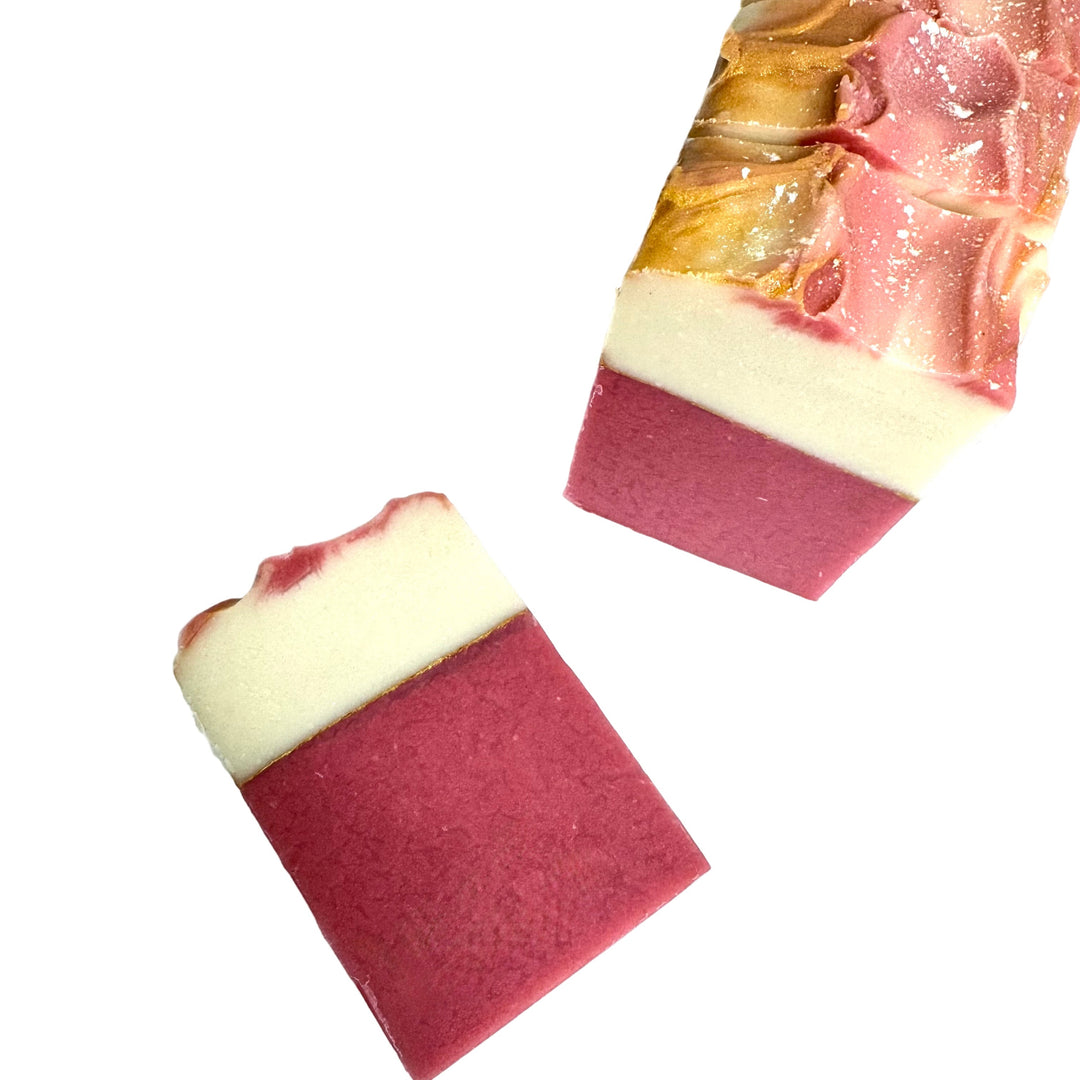 Handcrafted artisan soap bar with mauve base, creamy white center, and shimmering gold mica top, scented with juicy fig and amber, Forbidden Fig by Dirty Little Suds.