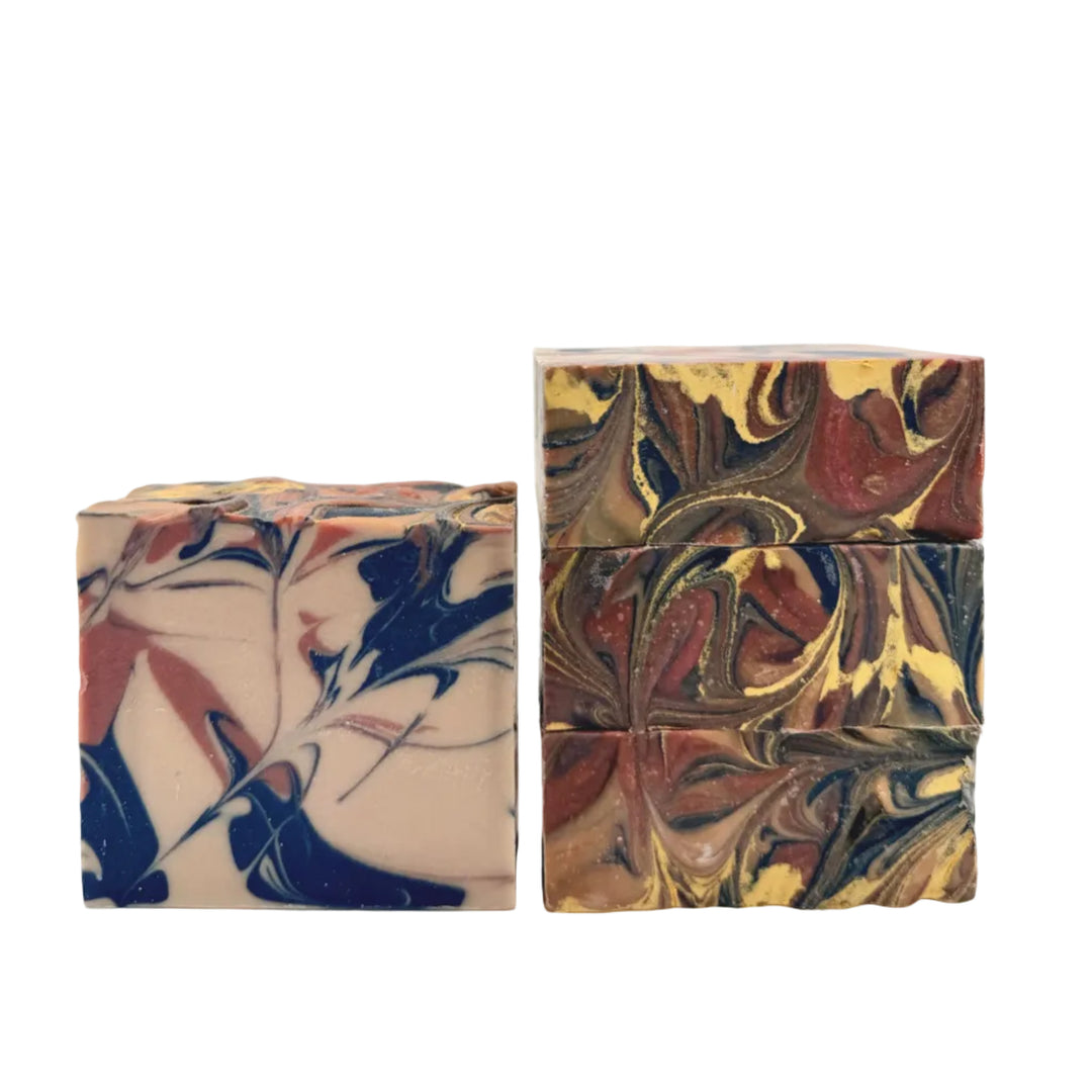 High Horse Society handmade soap with navy blue, rust, cream and gold swirls, scented with warm leather, vanilla, caramel and musk handmade by Dirty Little Suds