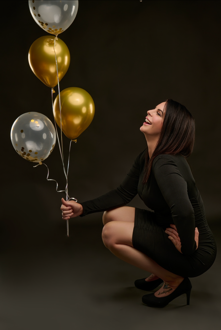 Image of Creator for Dirty Little Suds holding balloons