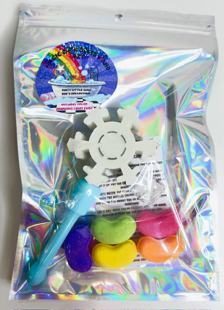 Holographic gift bag with the Snowflake Magic Bath Bomb Wand Kit by Dirty Little Suds. Includes white snowflake bath wand, colorful jelly bean bath bombs, flashing cube, and care card.