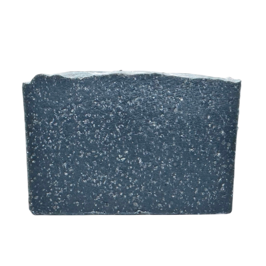 Black handmade mechanic’s soap bar with activated charcoal and bamboo exfoliant, rugged men’s soap designed to cut through grease, oil, and grime.