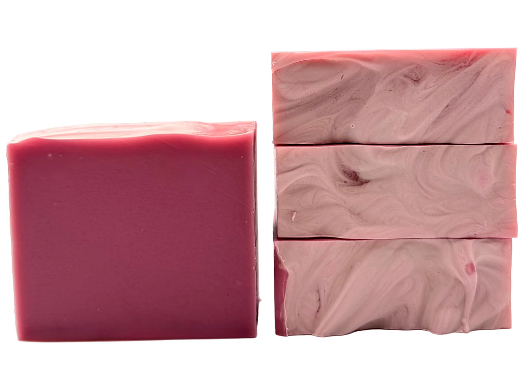Bold pink handmade soap bars with subtle marbled swirl pattern in blush and rose tones