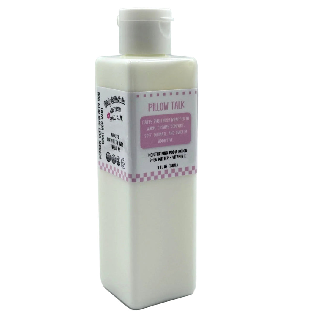 Dirty Little Suds Pillow Talk body lotion in a white rectangular bottle with a flip-top cap and pink label, featuring a soft, creamy scent of marshmallow, sugar, and caramel.