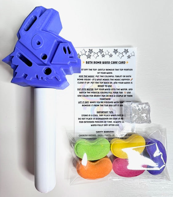 Purple llama bath wand kit contents displayed with bath bombs, flashing cube, and care card on white background.