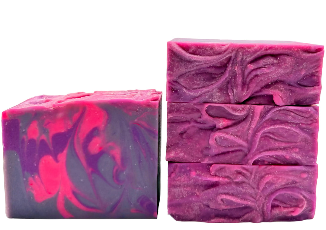 Purple and pink marbled handmade soap bars with vibrant swirling pattern and textured top