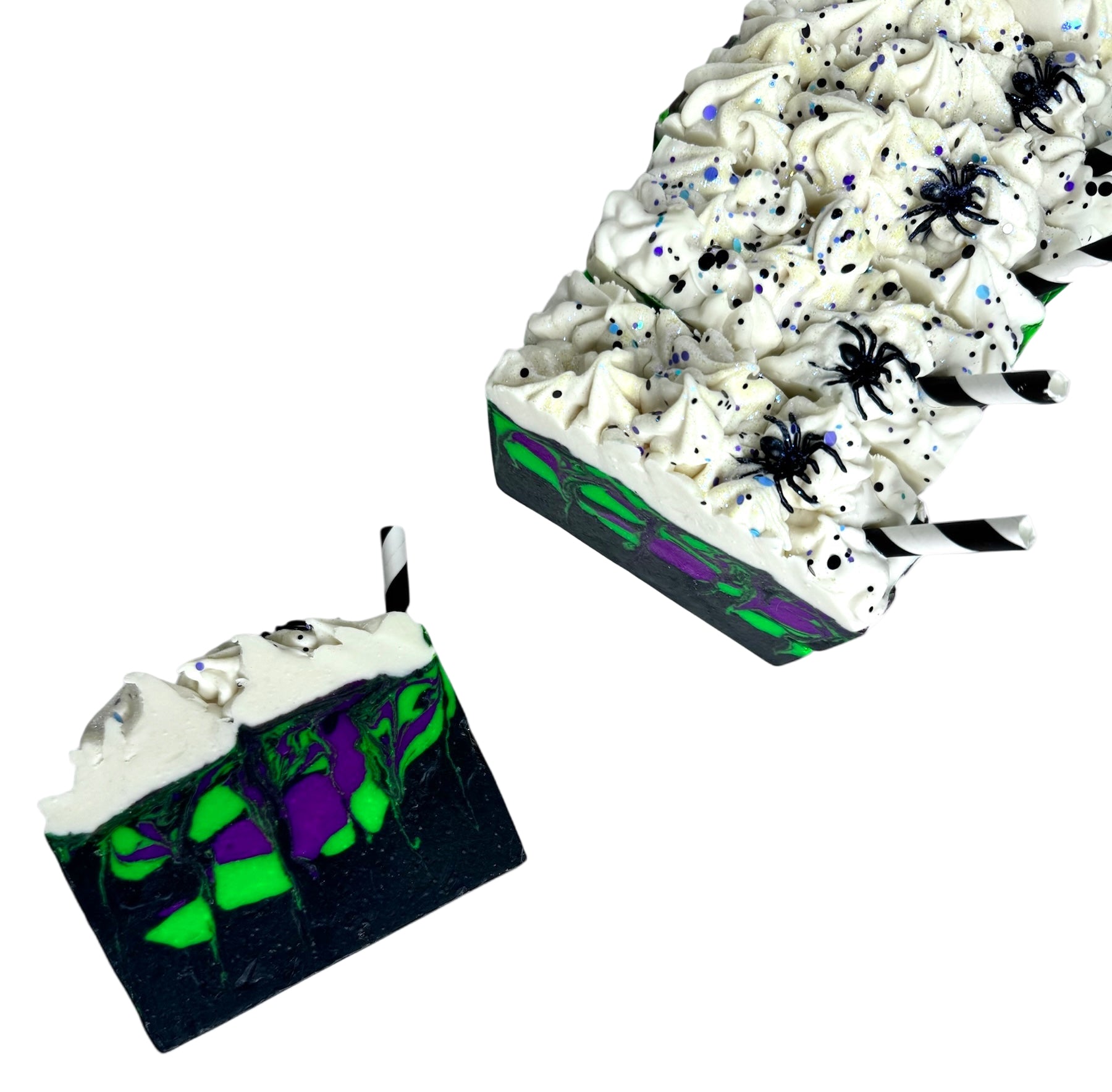 Scream Soda handmade Halloween soap bars with black, green, and purple swirls, topped with white frosting, glitter, spiders, and paper straws