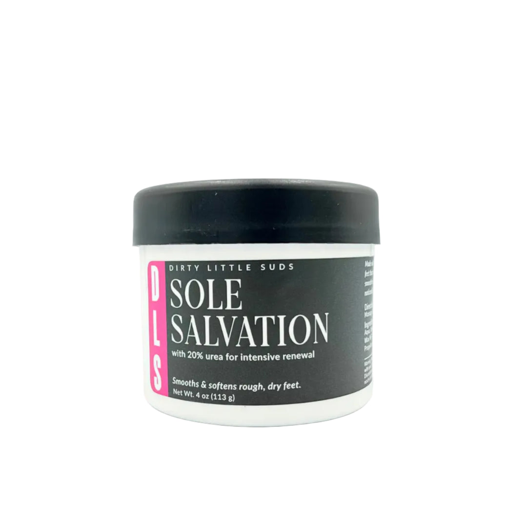 Closed white jar of Sole Salvation 20% Urea Foot Cream with a black Dirty Little Suds label featuring turquoise accents, photographed on a white background.