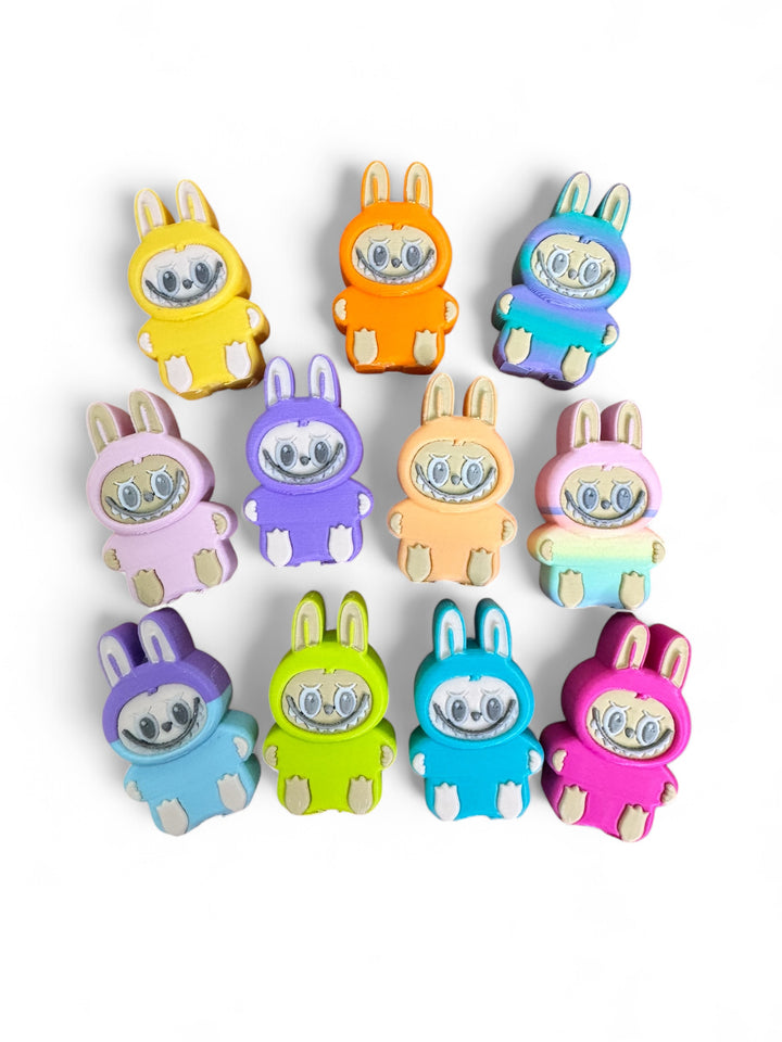 Set of colorful 3D-printed Tiny Labubu collectibles in assorted colors, Series 1 from Dirty Little Suds.
